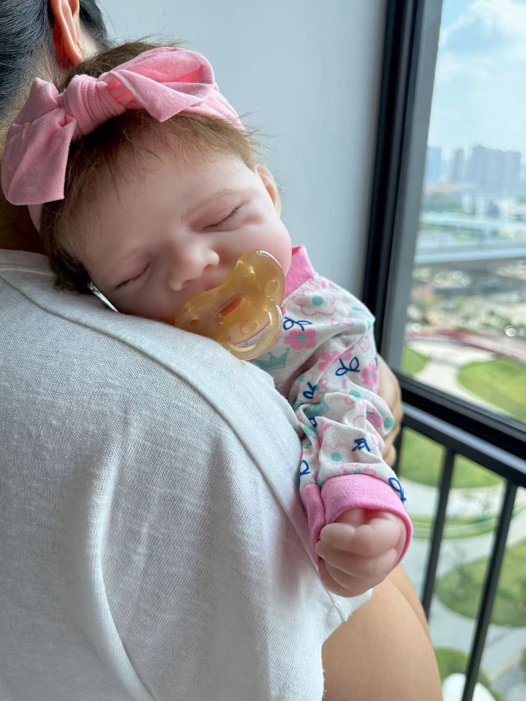 Silicone reborn baby doll being held