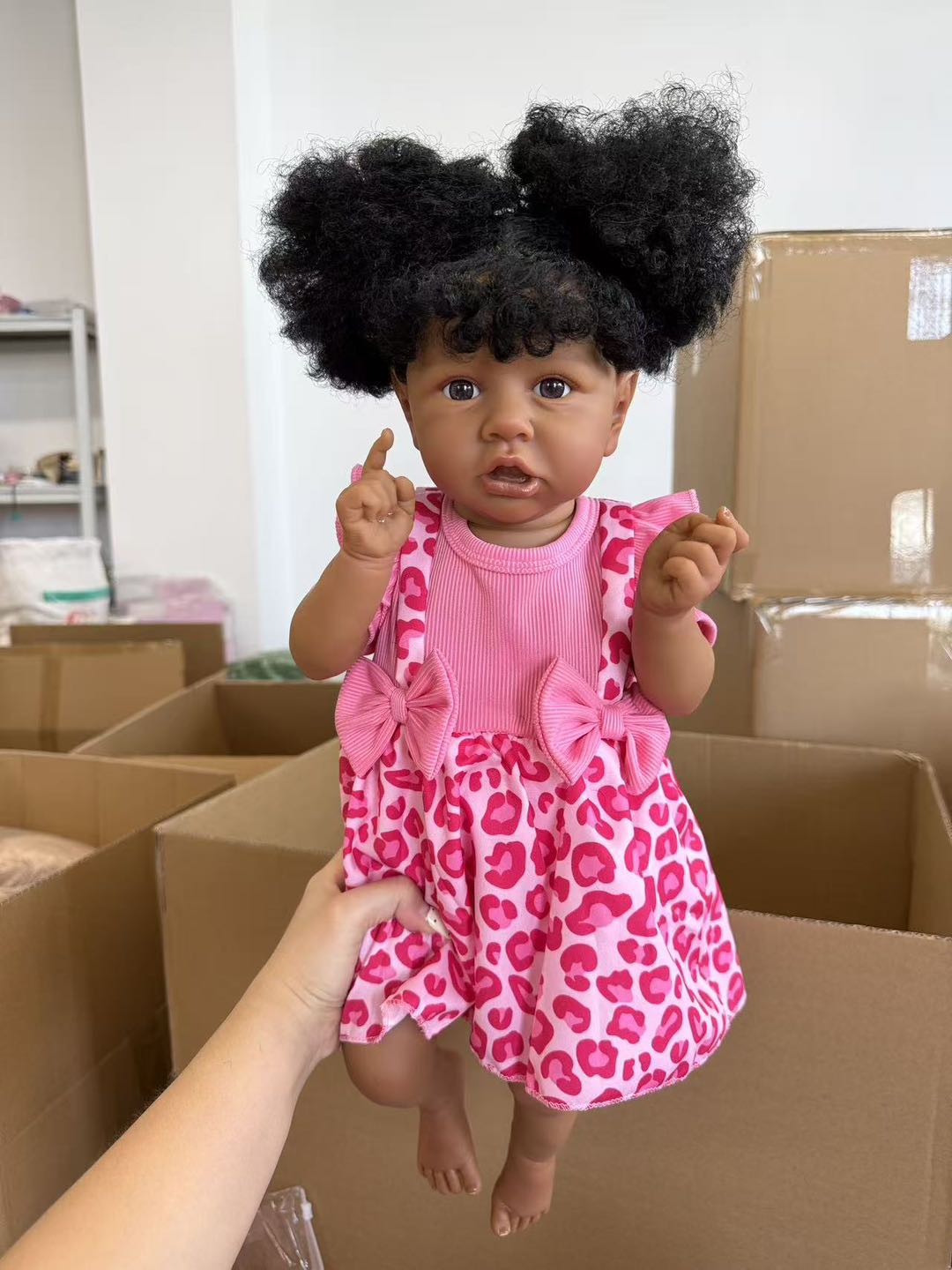 African Reborn Baby Doll - Pink Leopard Romper real photo