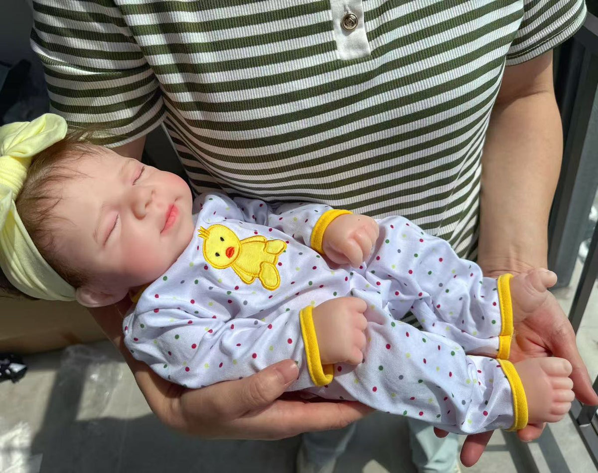 Little Ducky silicone reborn baby doll being held
