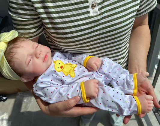 Little Ducky silicone reborn baby doll being held