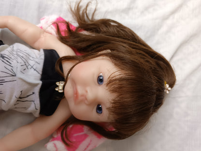 Tiny Darling long hair lying down blue eyes