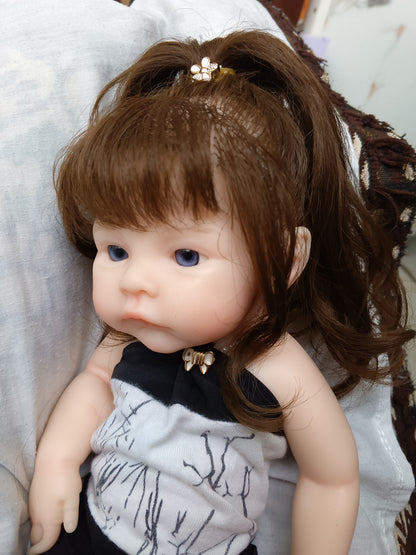 Tiny Darling long brown hair front face close up