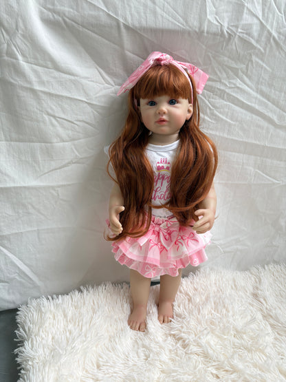 Reborn toddler girl doll standing - front view