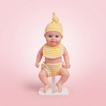 Sunshine Baby 6 inch silicone doll soft pink background