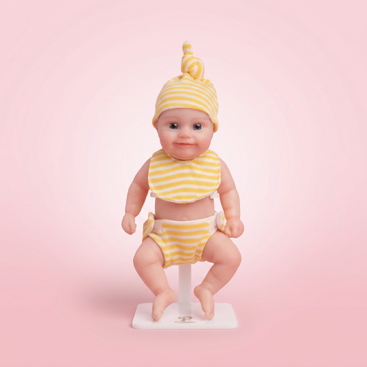 Sunshine Baby 6 inch silicone doll soft pink background
